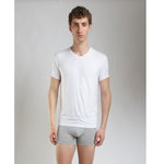 Side view of model wearing SilkCut Micro Modal Air v-neck undershirt demonstrating slim tailored fit