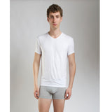 Side view of model wearing SilkCut Micro Modal Air v-neck undershirt demonstrating slim tailored fit
