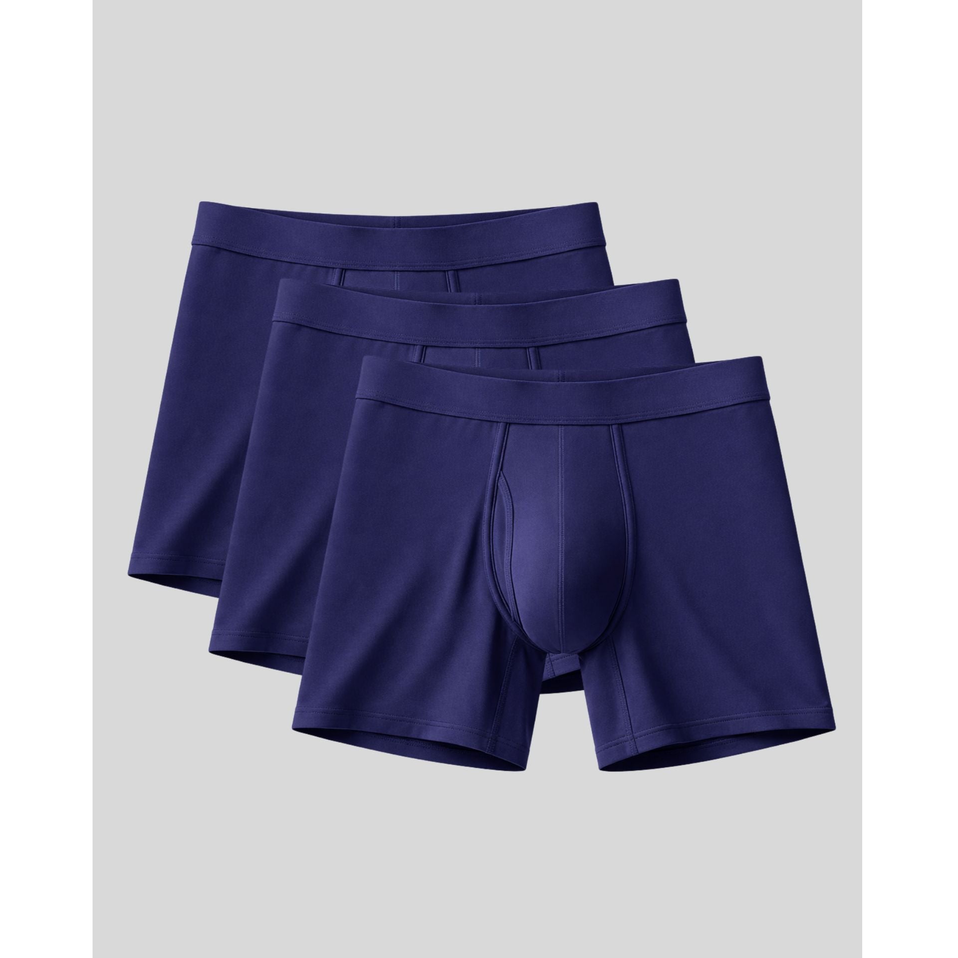 Three pairs of purple boxer briefs on a light gray background