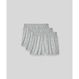SilkCut men’s boxers displayed with travel essentials flat lay
