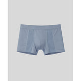 Blue boxer briefs on a light gray background