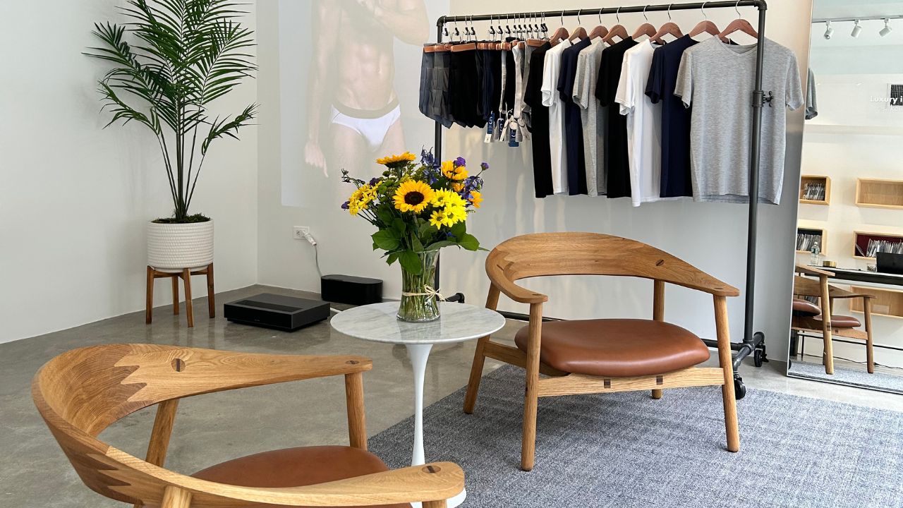 Inside SilkCut Williamsburg Pop Up showing Micro Modal Air underwear display wooden chairs flowers and soft natural lighting emphasizing premium comfort