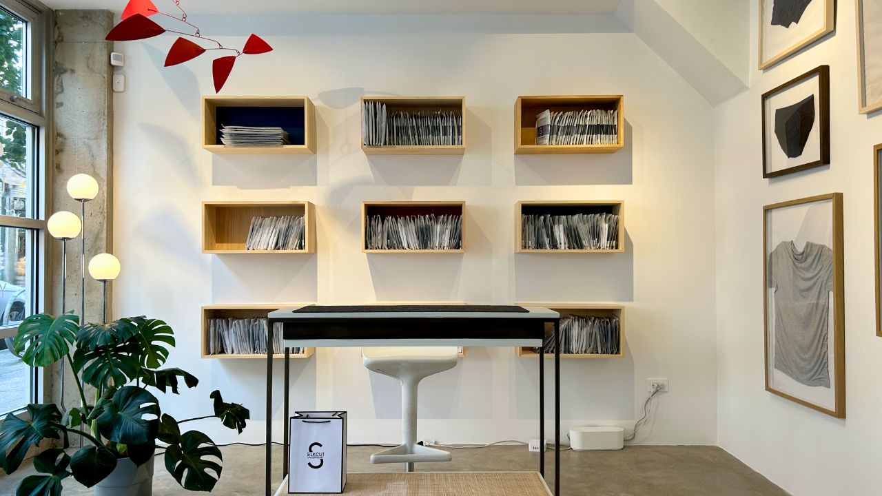 SilkCut Williamsburg Pop Up interior wall display featuring folded mens underwear framed art and minimalist design in Brooklyn showroom