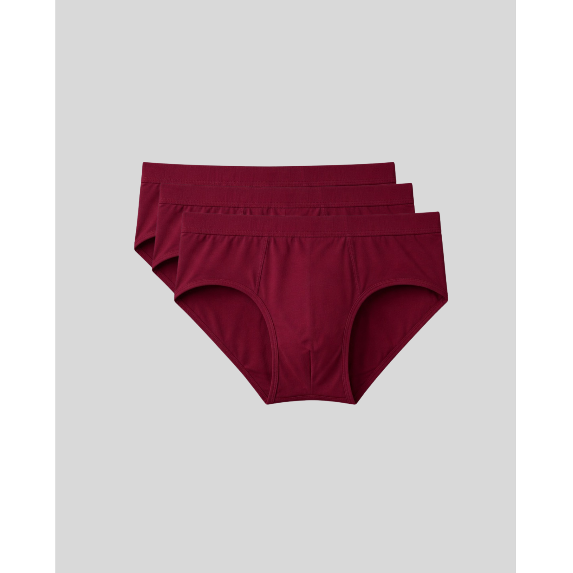 Two pairs of maroon underwear on a light gray background