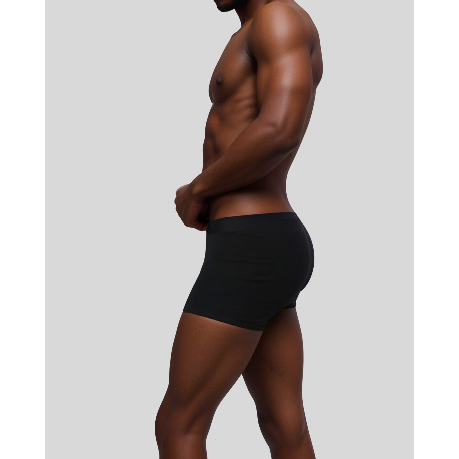 Side view of male model wearing SilkCut black Modal Stretch Trunk highlighting ergonomic pouch and leg fit